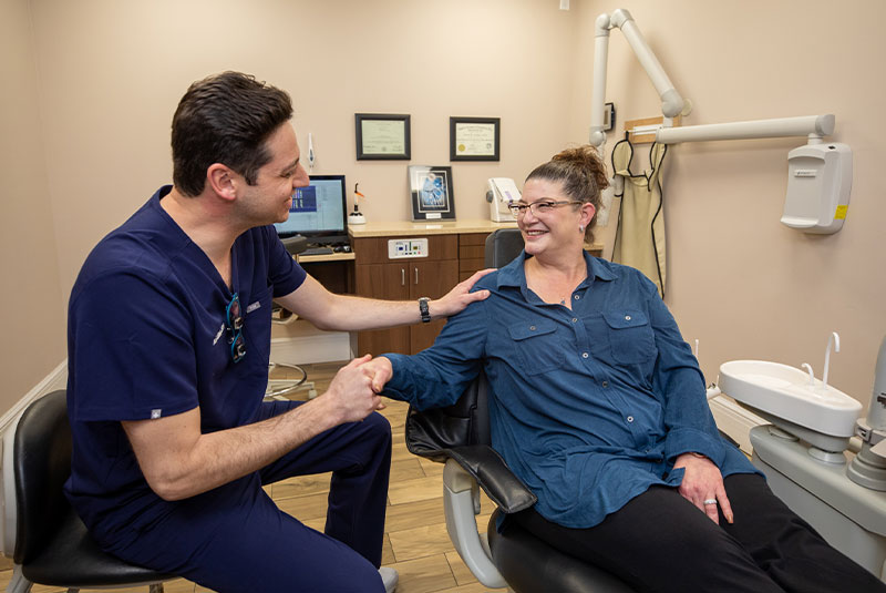 dental patient smiling with Dr. Gitlin.