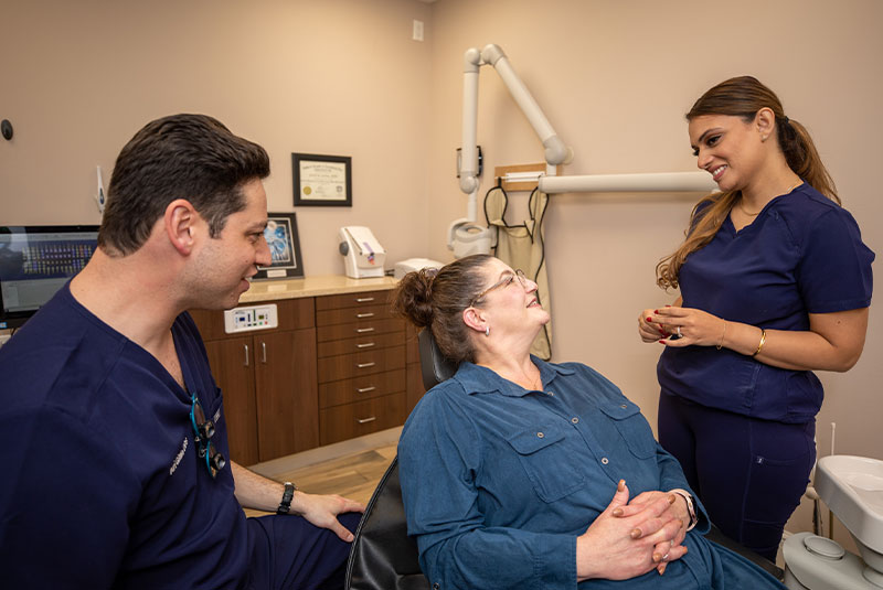 dental patient smiling in dental chair