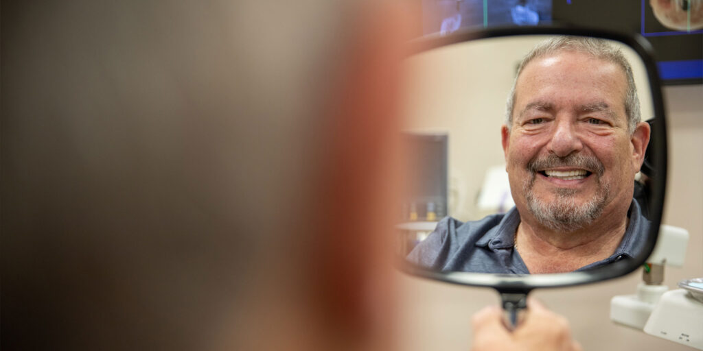 patient smiling brightly after their dental treatment