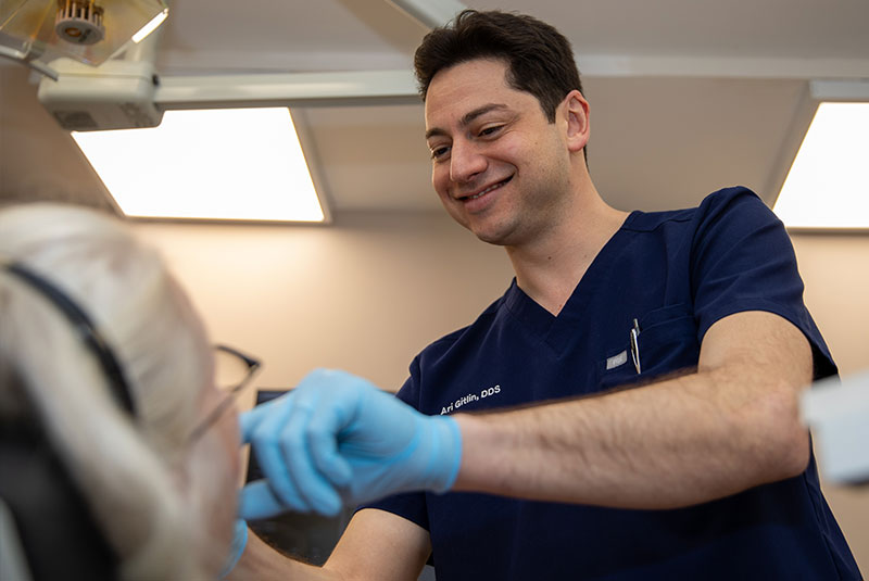 doctor examining patient for dental treatment