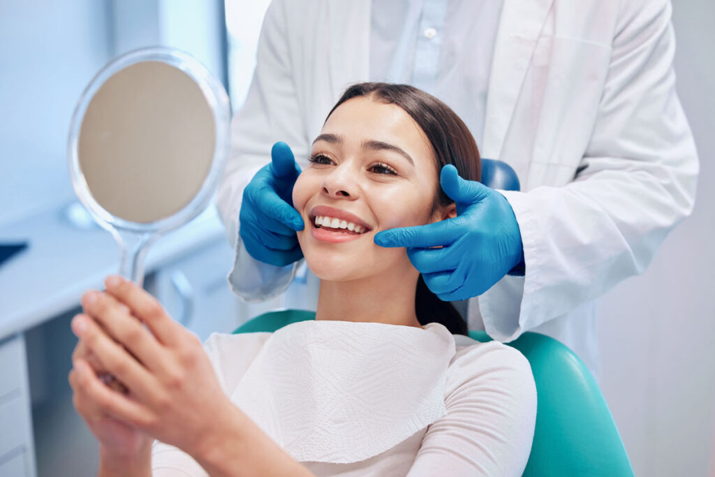 Dental Patient looking into mirror