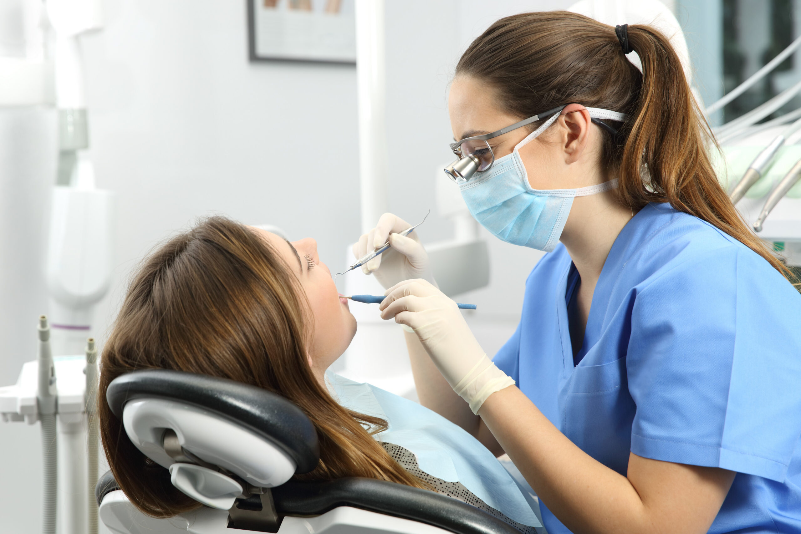 Dental Patient sitting with Dentist